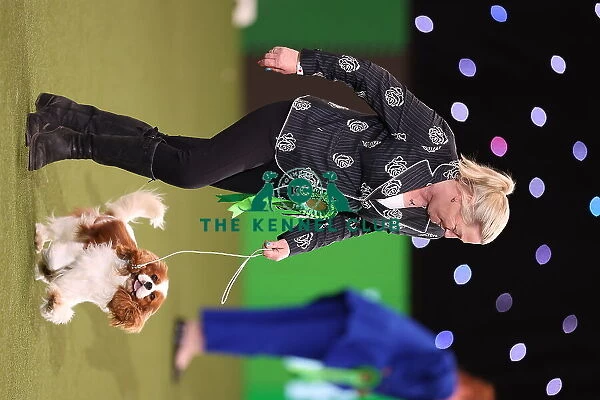 Tanya Ireland from Essex, with Dublin, a Cavalier King Charles Spaniel, which was the Best in Group winner today (Sunday 12. 03. 23), the last day of Crufts 2023, at the NEC Birmingham