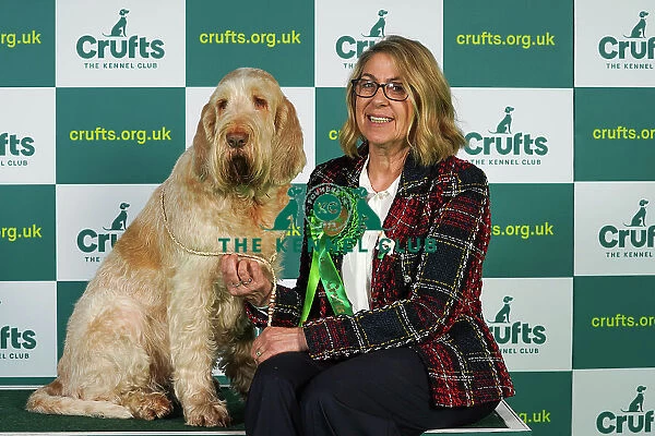 Trudi Jones from Pembrokeshire with Flossy, an Italian Spinone, which was the Best of Breed winner today (Thursday 09. 03. 23), the first day of Crufts 2023, at the NEC Birmingham
