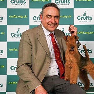 Andrew Westwood from Dudley with Mac, a Lakeland Terrier, which was the Best of Breed winner today (Saturday 11. 03. 23), the third day of Crufts 2023, at the NEC Birmingham
