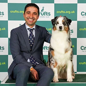 Artur Bullani from Italy with Queen, an Australian Shepherd, which was the Best of Breed winner today (Friday 10. 03. 23), the second day of Crufts 2023, at the NEC Birmingham