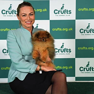 Camilla Kristoffersen from Norway, with Ceasar, a Pomeranian, which was the Best of Breed winner today (Sunday 12. 03. 23), the last day of Crufts 2023, at the NEC Birmingham