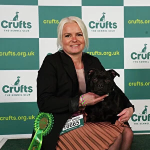 Catrine Arntzen from Norway with Lea, a Staffordshire Bull Terrier, which was the Best of Breed winner today (Saturday 11. 03. 23), the third day of Crufts 2023, at the NEC Birmingham