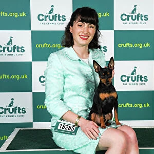 Charlotte Westerman from Darlington, with Otto, a Miniature Pinscher, which was the Best of Breed winner today (Sunday 12. 03. 23), the last day of Crufts 2023, at the NEC Birmingham