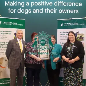 Emma Green receiving her KCAI certificate for the Kennel Club Accredited Training Scheme with Paul Rawlings, Helen Kerfoot and Angela White, KCAI Vice Chair