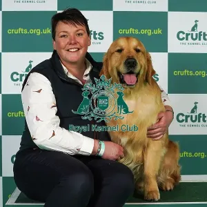 Katherina Savage from Wexford with Killian, a Golden Retriever, which was the Best of Breed winner today (Thursday 09. 03. 23), the first day of Crufts 2023, at the NEC Birmingham