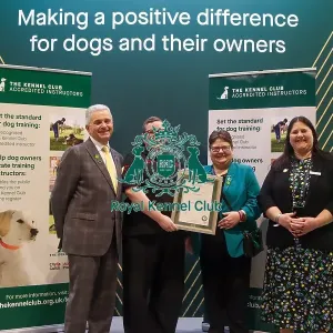 Lillie Abbot receiving her KCAI certificate for the Kennel Club Accredited Training Scheme with Paul Rawlings, Helen Kerfoot and Angela White, KCAI Vice Chair