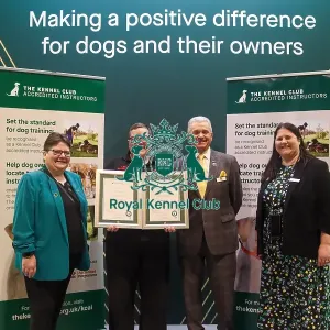 Lillie Abbot receiving her KCAI certificate for the Kennel Club Accredited Training Scheme with Paul Rawlings, Helen Kerfoot and Angela White, KCAI Vice Chair