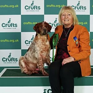 Linda Graham from Cumbria with Kion, a Brittany, which was the Best of Breed winner today (Thursday 09. 03. 23), the first day of Crufts 2023, at the NEC Birmingham