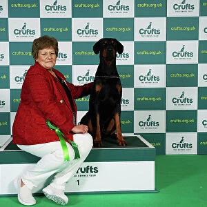 Mandy Everley from West Sussex with Archie, a Doberman, which was the Best of Breed winner today (Friday 10. 03. 23), the second day of Crufts 2023, at the NEC Birmingham