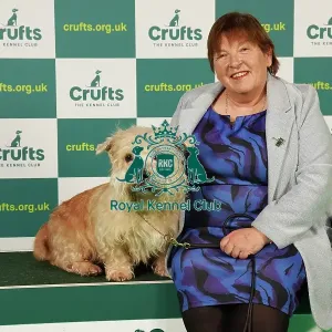 Marie McNally from Wexford with Karma, a Glen of Imaal Terrier, which was the Best of Breed winner today (Saturday 11. 03. 23), the third day of Crufts 2023, at the NEC Birmingham