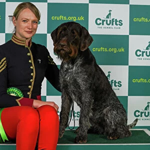 Nicki Johnston from Colchester with Zena, a German Wirehaired Pointer, which was the Best of Breed winner today (Thursday 09. 03. 23), the first day of Crufts 2023, at the NEC Birmingham
