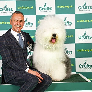 Nikolas Kanals Matteo Autolitano from Greece/Italy with Blondie, an Old English Sheepdog, which was the Best of Breed winner today (Friday 10. 03. 23), the second day of Crufts 2023, at the NEC Birmingham