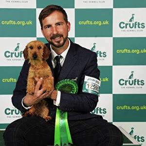 Noel Garrigos from Spain with Llimona, a Dachshund (Miniature Wire Haired), which was the Best of Breed winner today (Saturday 11. 03. 23), the third day of Crufts 2023, at the NEC Birmingham