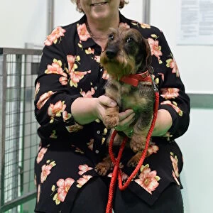 owner and her wirehaired dachshund at their discover dogs stand