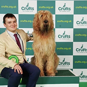 Robin Alner from Kidderminster with Dreadnaught, an Otterhound, which was the Best of Breed winner today (Saturday 11. 03. 23), the third day of Crufts 2023, at the NEC Birmingham