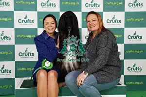 Claire Millward and Liz Millward from Sheffield with Alfie, an Afghan Hound, which was the Best of Breed winner today (Saturday 11. 03. 23), the third day of Crufts 2023, at the NEC Birmingham