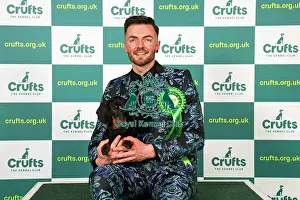 Craig Young from Henley, Ireland with Edward, a Dachshund (Smooth Haired), which was the Best of Breed winner today (Saturday 11. 03. 23), the third day of Crufts 2023, at the NEC Birmingham