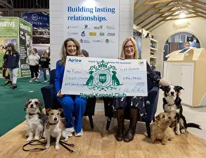 Vicki Wentworth Prints: Jennifer Millard - Chair of the Kennel Club Charitable Trust is presented by with a cheque by Vicki Wentworth CEO AGRI