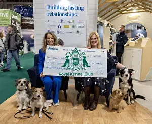 Vicki Wentworth Prints: Jennifer Millard - Chair of the Kennel Club Charitable Trust is presented by with a cheque by Vicki Wentworth CEO AGRI