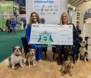 Vicki Wentworth Prints: Jennifer Millard - Chair of the Kennel Club Charitable Trust is presented by with a cheque by Vicki Wentworth CEO AGRI