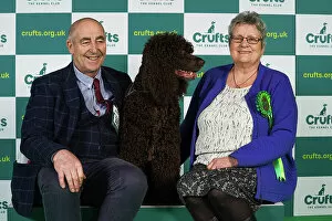 Official photos from Crufts 2023: John Hackett and Angela Williams from Sunderland with Finn, an Irish Water Spaniel