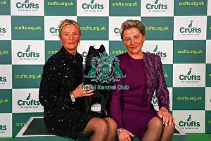 Lindsey McLachlan and Joanne McLachlan from The Wirral, with Stellon, a Schipperke, which was the Best of Breed winner today (Sunday 12. 03. 23), the last day of Crufts 2023, at the NEC Birmingham