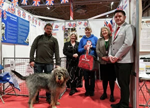 The Otterhound Club being awarded the Best Discover Dogs Stand for the Hound Group at Crufts on Sunday 10th March 2024 by Alison Scutcher, Nicky Ackerley-Kemp (Directors at The Kennel Club) and Ricky Furnell from Royal Canin
