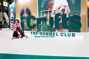 Border Collie Prints: Owners Posing With Their Border Collie In Front Of The Crufts Banner