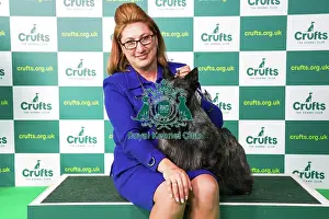 Rebecca Cross from Pennsylvania, USA, with Jasper, a Scottish Terrier, which was the Best of Breed winner today (Saturday 11. 03. 23), the third day of Crufts 2023, at the NEC Birmingham